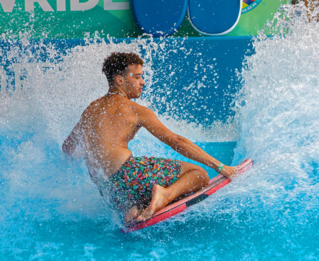 A guest on the flowrider at the Massanutten Indoor WaterPark