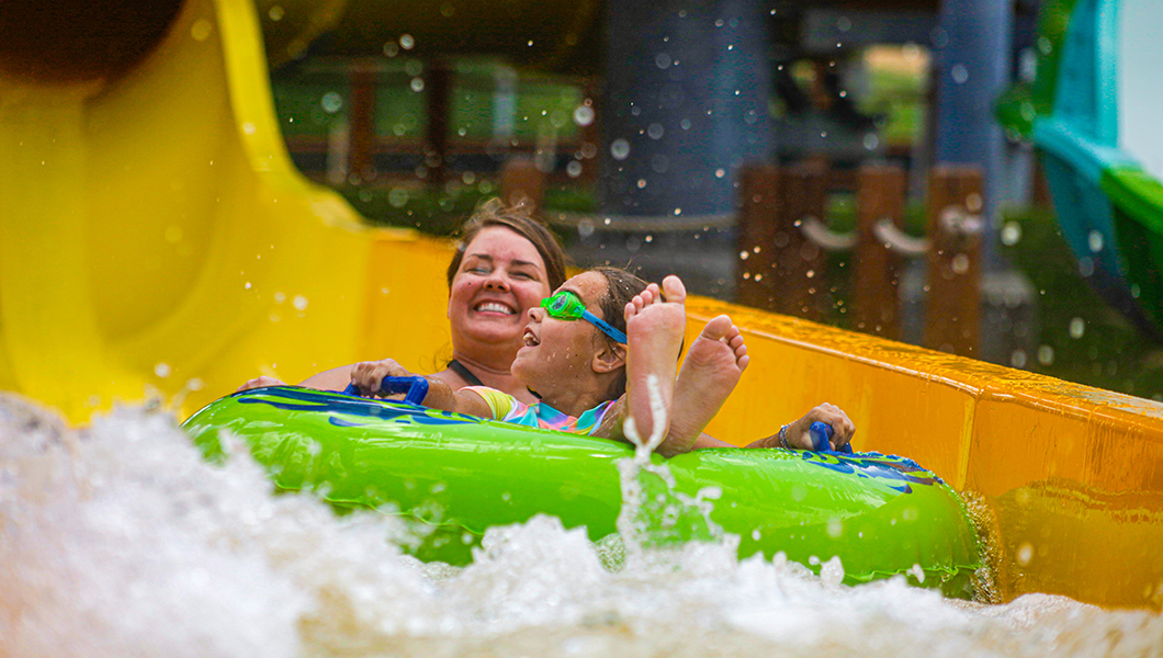 Two guests on a slide at the Massanutten Outdoor WaterPark