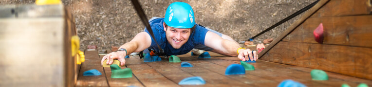 A man on the climing wall at Massanutten Family Adventure Park