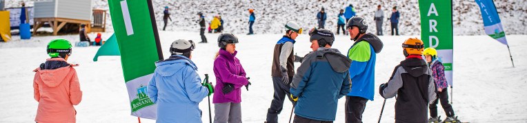 A group of people taking ski lessons