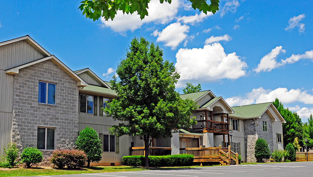 Exterior photo of Woodstone Meadows condo building