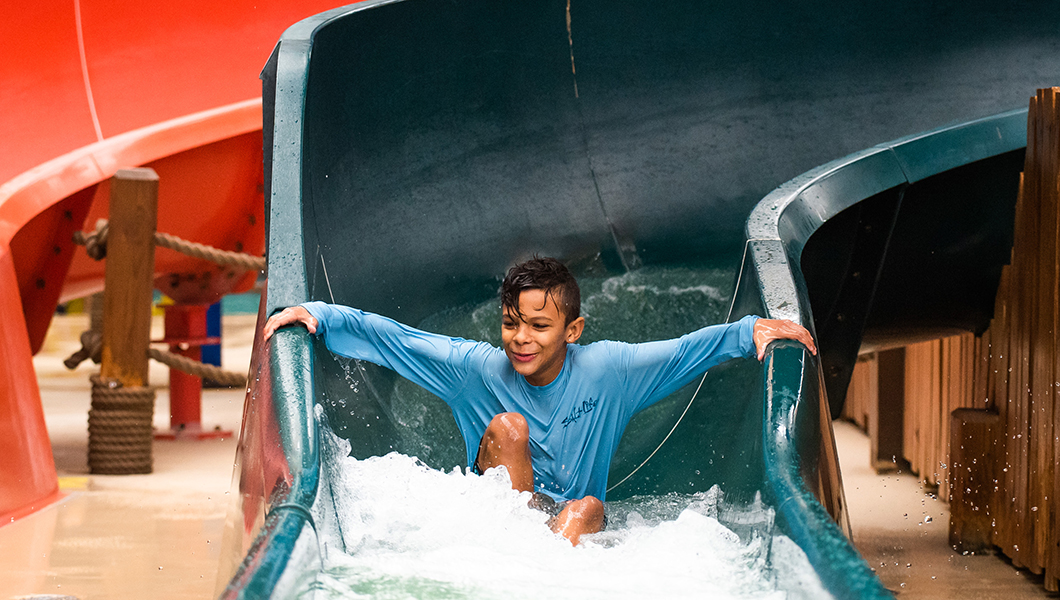 A boy on a slide at the Massanutten Indoor WaterPark