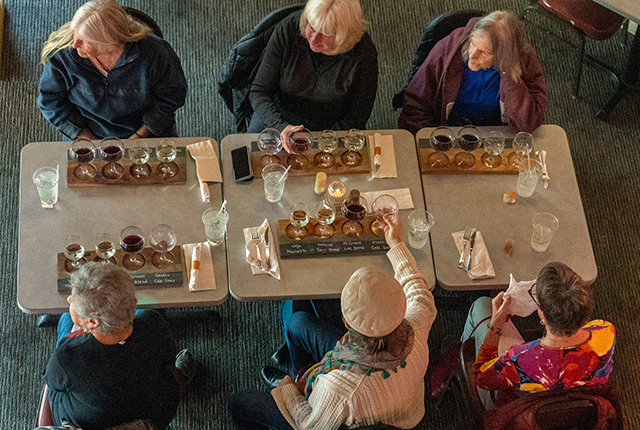 Overhead view of guests enjoying wine flights