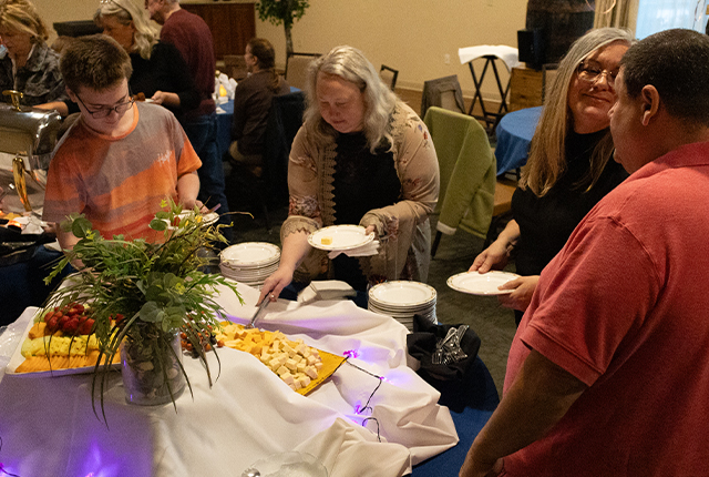 Guests enjoying food at a dining event