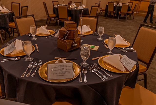 A table setting with event cards