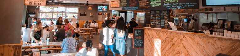 Guests inside Virginia BBQ & Pizza Co.