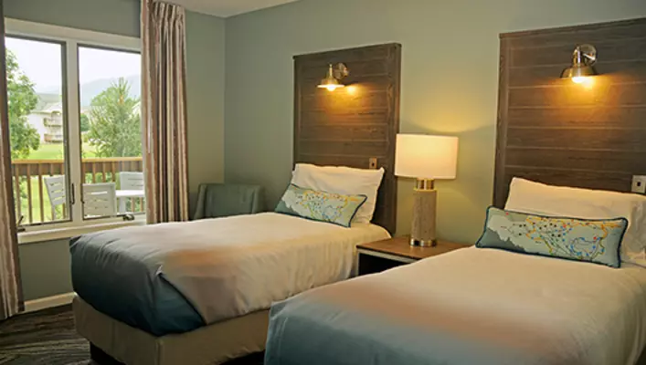 Interior photo of Woodstone Meadows condo twin beds in secondary bedroom